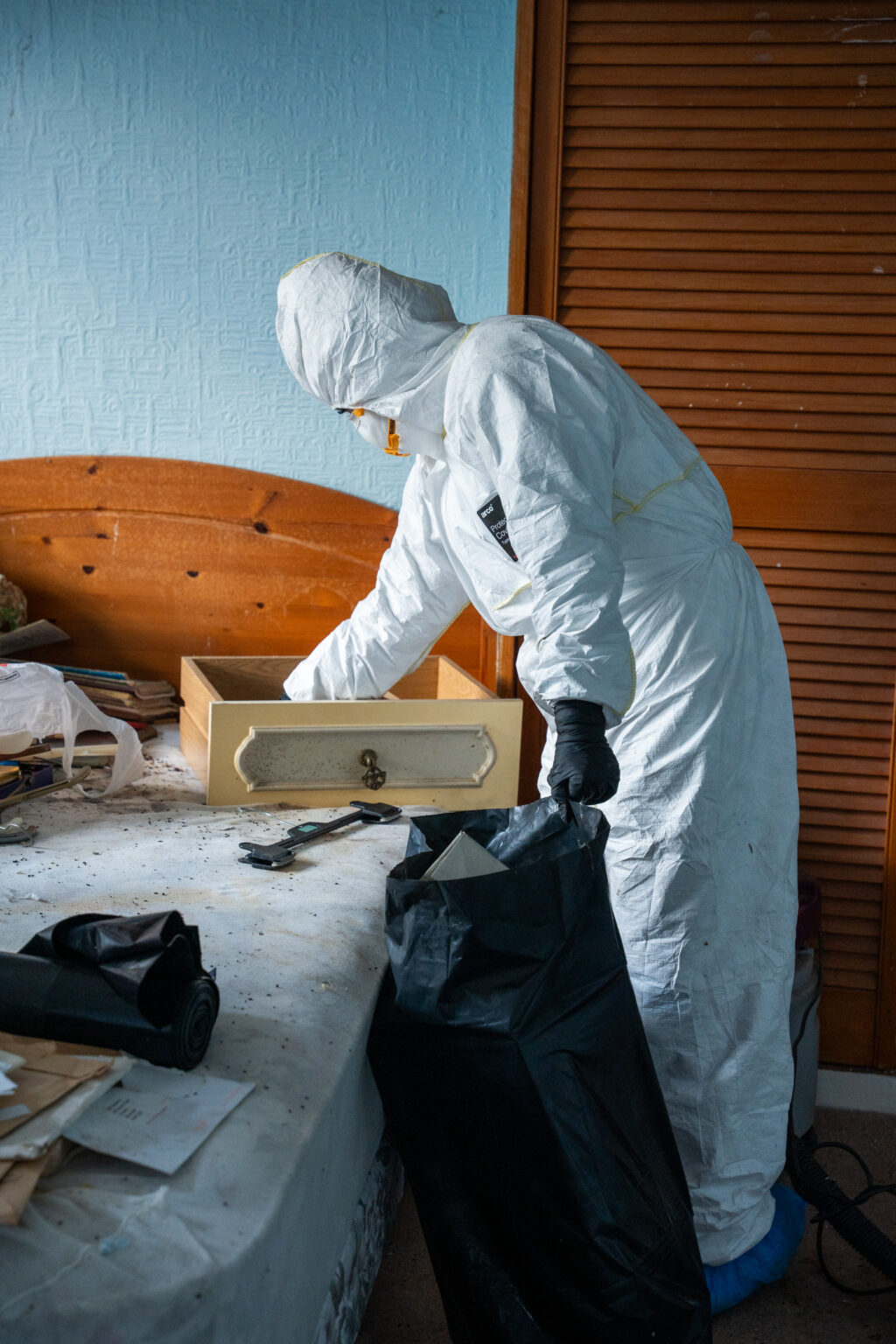 BioSure technician in full PPE performing specialist clean-up